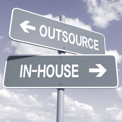 Picture of a signpost with the words “outsourcing” and “in-house”